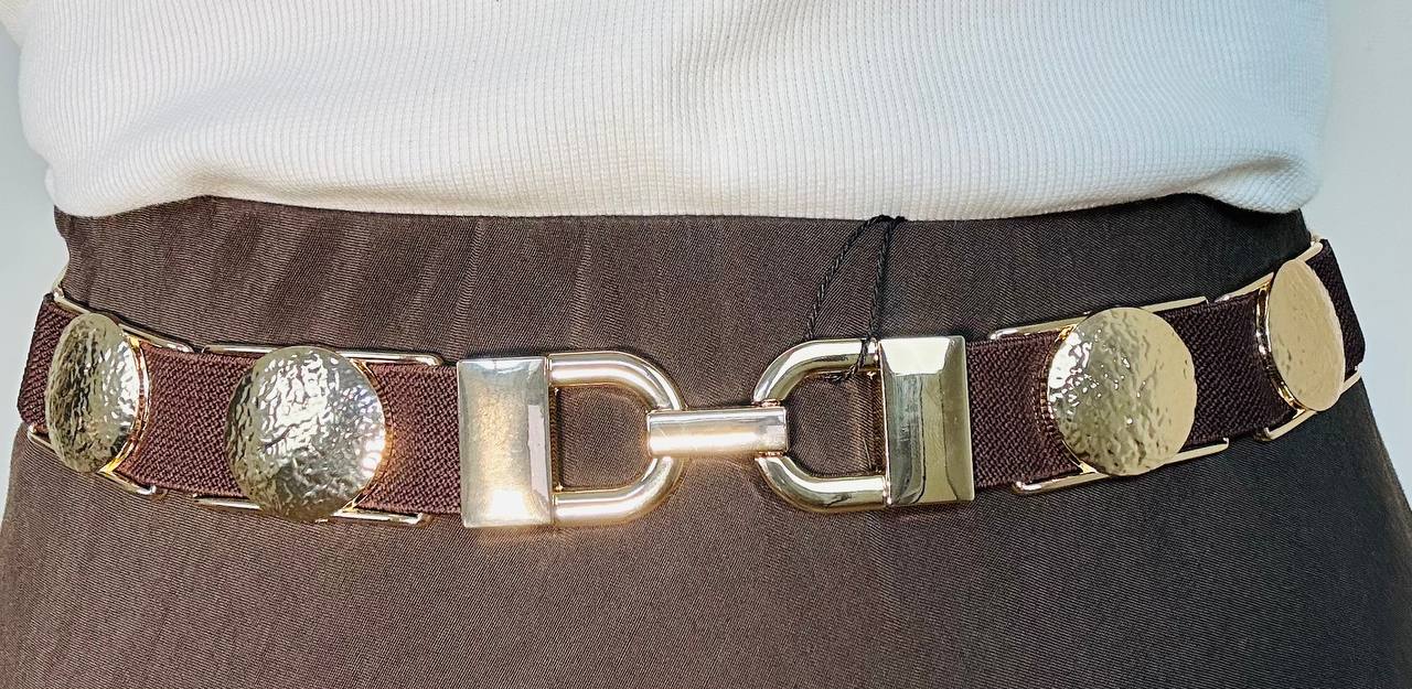 Cintura completamente  elasticizzata con inserti  dorati a cerchio